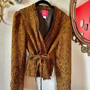 Vintage-y from Anthropologie. Distressed look. Large fits like a medium.